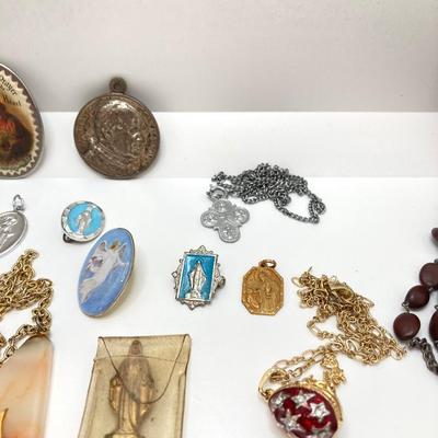 LOT 609: Religious Collection - Stone Pendant w/Gold Tone Chain, Crystal Heart Pendant w/Cross, Red Enamel & Rhinestone Guardian...