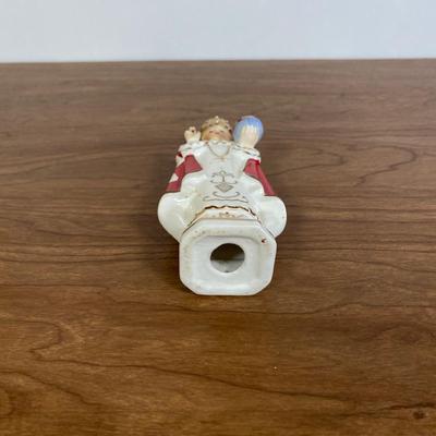 LOT 70D: Various Religious Memorabilia, including a Metal Shrine, Jesus on the Cross, and Porcelain Figurines