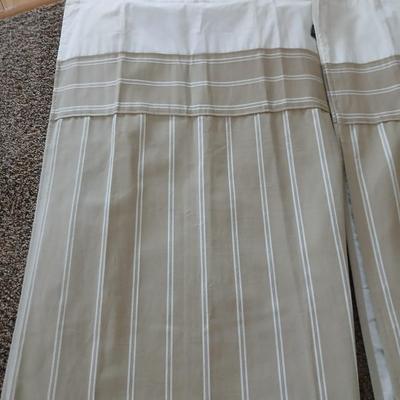 Three long sets of curtains with metal rings for rod