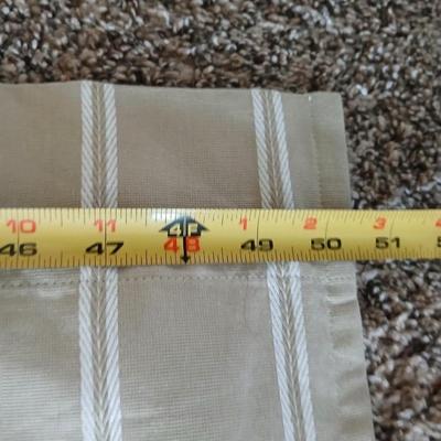Three long sets of curtains with metal rings for rod