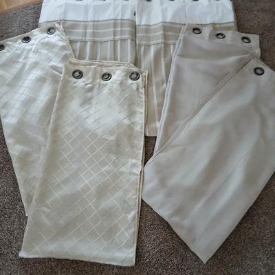 Three long sets of curtains with metal rings for rod