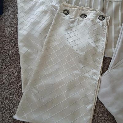 Three long sets of curtains with metal rings for rod