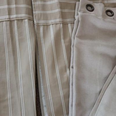 Three long sets of curtains with metal rings for rod