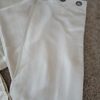 Three long sets of curtains with metal rings for rod