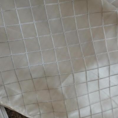 Three long sets of curtains with metal rings for rod