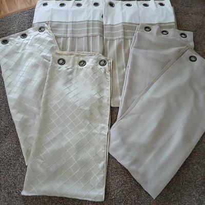 Three long sets of curtains with metal rings for rod