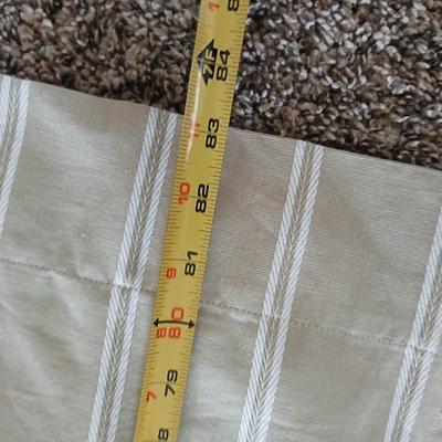 Three long sets of curtains with metal rings for rod