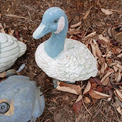 Two hard plastic ducks and a frog sprinkler