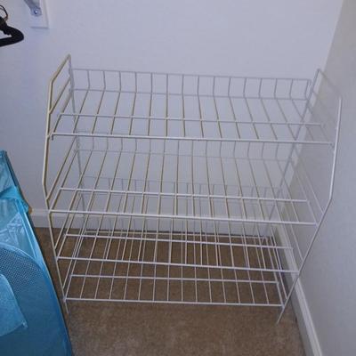 Metal shelf for organizing closet, Mesh laundry hamper and a bunch of coat hangers