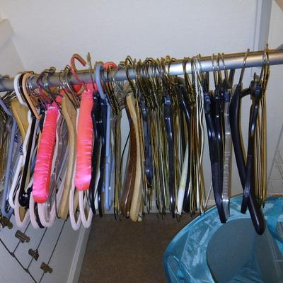 Metal shelf for organizing closet, Mesh laundry hamper and a bunch of coat hangers