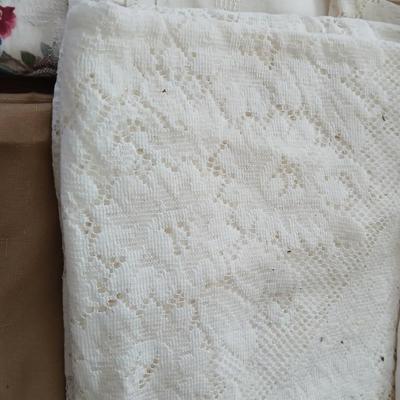 Table linens - nice lace, and other beautiful, patterned tablecloths