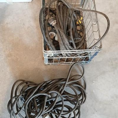 Metal milk crate with a variety of extension cords