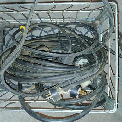 Metal milk crate with a variety of extension cords
