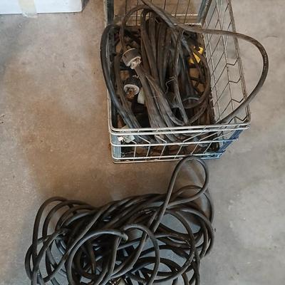Metal milk crate with a variety of extension cords