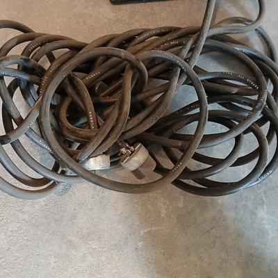 Metal milk crate with a variety of extension cords