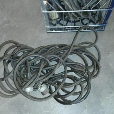 Metal milk crate with a variety of extension cords