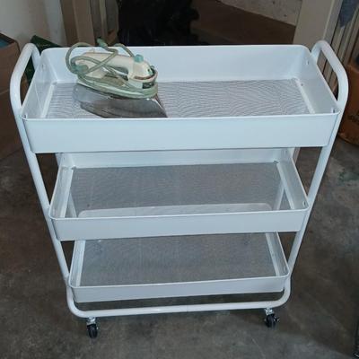 White metal cart with clothes iron