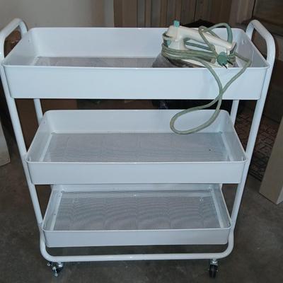 White metal cart with clothes iron