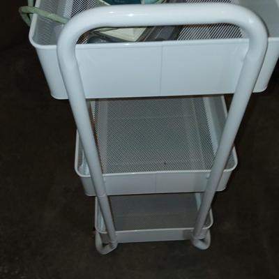 White metal cart with clothes iron