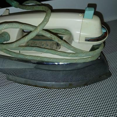 White metal cart with clothes iron