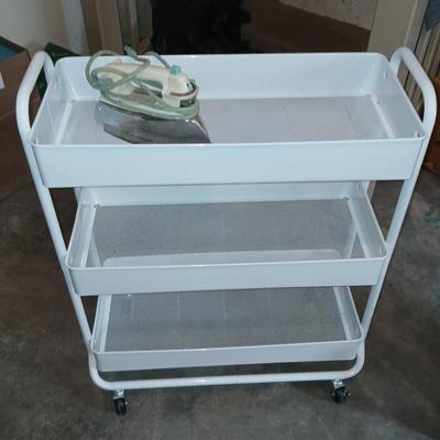 White metal cart with clothes iron