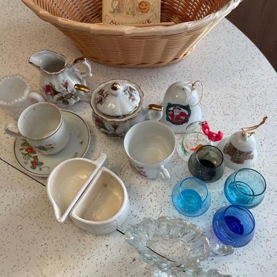 Misc glass items with basket and small book
