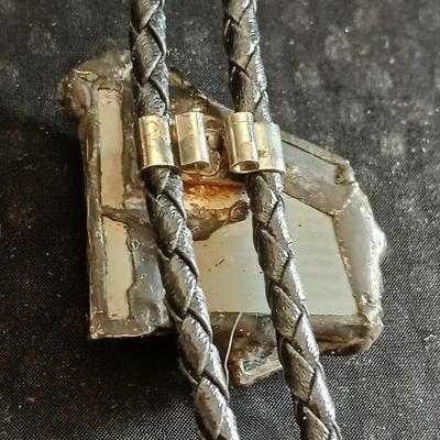 Vintage longhorn belt buckle with art deco bolo tie