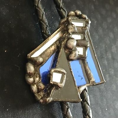 Vintage longhorn belt buckle with art deco bolo tie