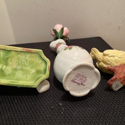 Green and gold candle holder with birds and vase