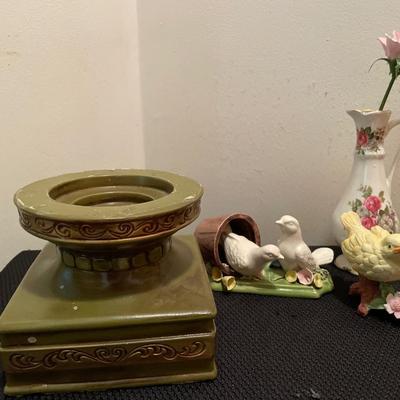 Green and gold candle holder with birds and vase