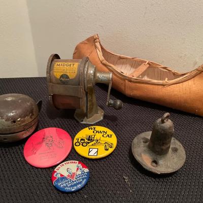 Vintage bell, anchor, pins, sharpener and paper canoe