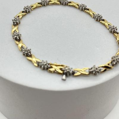 LOT 27J: 10K Gold and Diamond 7” Bracelet - 6.1 gtw- Kisses and Hugs Design