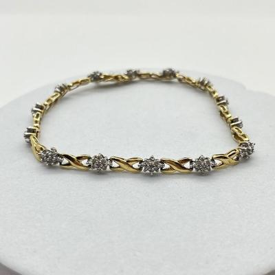 LOT 27J: 10K Gold and Diamond 7” Bracelet - 6.1 gtw- Kisses and Hugs Design