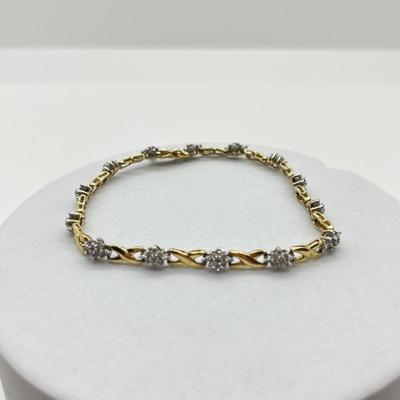 LOT 27J: 10K Gold and Diamond 7” Bracelet - 6.1 gtw- Kisses and Hugs Design