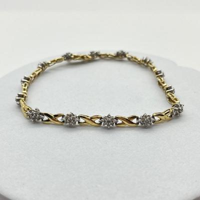 LOT 27J: 10K Gold and Diamond 7” Bracelet - 6.1 gtw- Kisses and Hugs Design