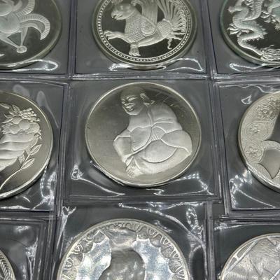 LOT 44: 1977 Franklin Mint Good Luck Sterling Silver Medal Collection - 12 Medals + COAs