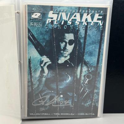 LOT 45: Collection of Signed Snake Plissken Chronicles Comic Books and More