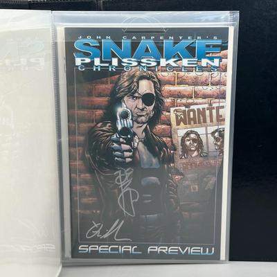 LOT 45: Collection of Signed Snake Plissken Chronicles Comic Books and More