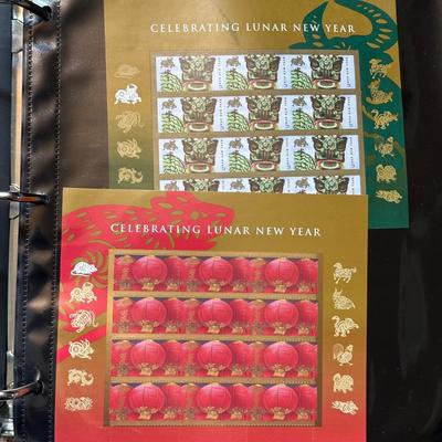 LOT 54: Stamp Collection - Two Albums Full Of Assorted Stamps!