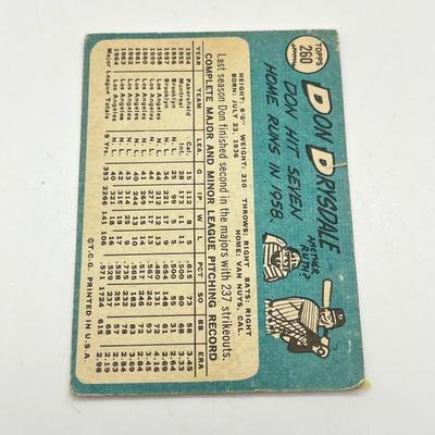 LOT 64: 1960s Baseball Cards - 1961 Ron Santo Rookie and Whitey Ford, 1962 Brooks Robinson and Whitey Herzog, 1965 Don Drysdale and More