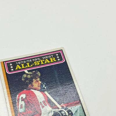 LOT 67: 8 Vintage NHL Cards - Bobby Orr, Gordie Howe, Bobby Clarke, and More