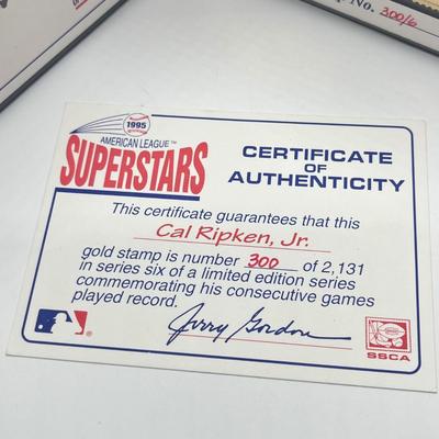 LOT 128: Cal Ripken Baseball Cards and 1996 23K Gold Stamp