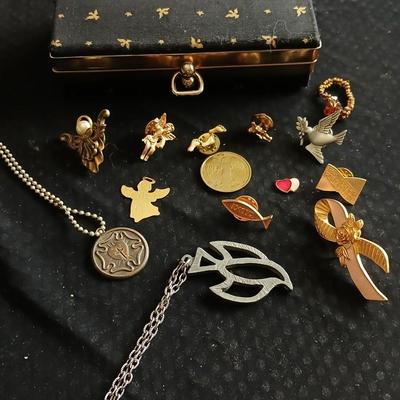 Vintage clasping box with angel pins and vintage Lutheran necklace