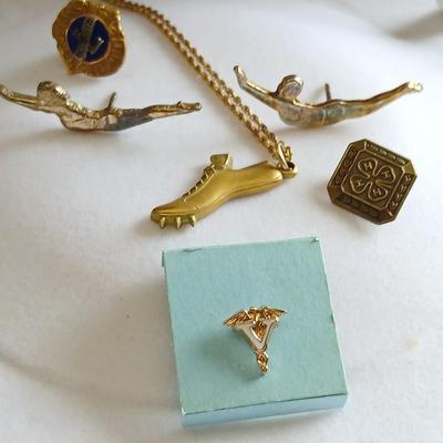 Award pins and a Cross Country 1954 10K GF necklace