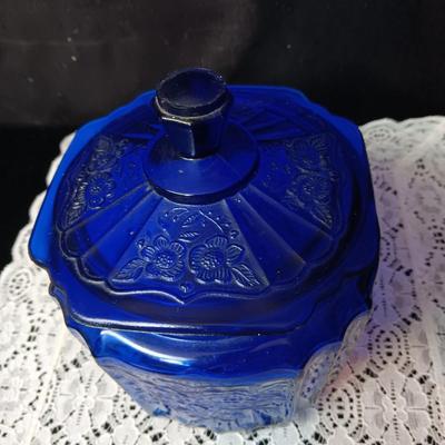 COBALT BLUE GLASS CANISTER W/LID, SMALL PITCHER AND 2 GLASS CUPS WITH RAISED BIRD DESIGN