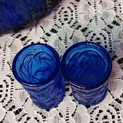 COBALT BLUE GLASS CANISTER W/LID, SMALL PITCHER AND 2 GLASS CUPS WITH RAISED BIRD DESIGN