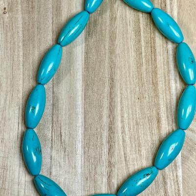 Sale Photo Thumbnail #545: Turquoise colored magnesite. 1 1/4” long beads