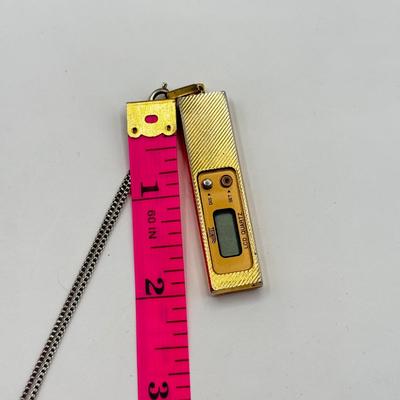 LOT 179J: Vintage Quintel LCD Quarts Clock Necklace & Bakelite Cuff Geneva Quartz Watch