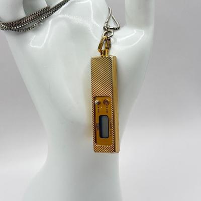 LOT 179J: Vintage Quintel LCD Quarts Clock Necklace & Bakelite Cuff Geneva Quartz Watch