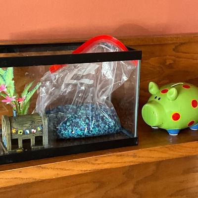 Fish aquarium and ceramic piggy bank